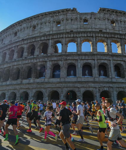 Runners passing the Colosseum during the Rome Marathon